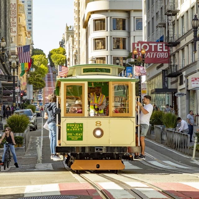 historic cable car going through san francisco