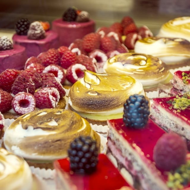 Close up of fresh made pastries with fresh berries on top